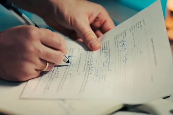 Signing an agreement with a fountain pen